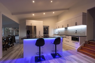 black and purple chairs on brown wooden floor