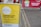 A yellow sign displays information about a contactless collection service, mentioning social distancing and sanitizing guidelines. It is set on the pavement near a parking area. Behind the sign, there is a red banner indicating a dedicated parking spot for a park and pick-up service.