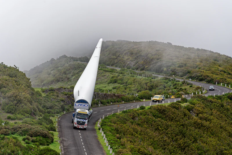Long wind turbine blade on a mountain road