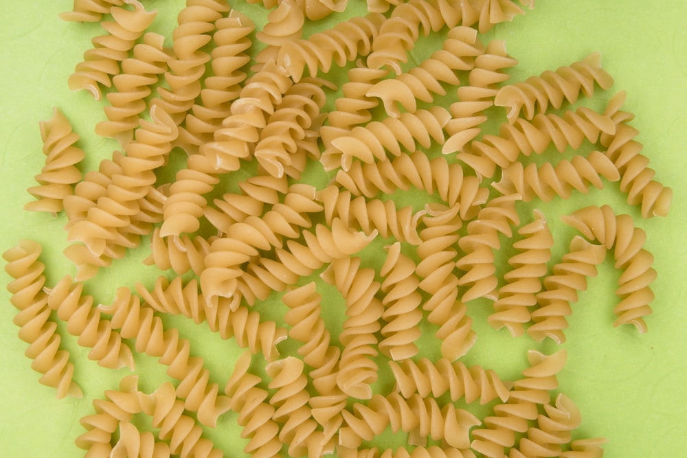 yellow pasta on green plate