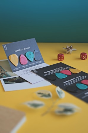 Colorful Phish concert memorabilia displayed alongside gaming gear in a personal collection.