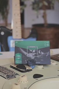 blue and green box on brown wooden table