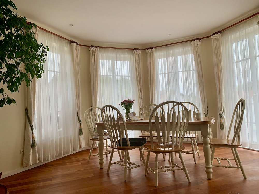 brown wooden table and chairs