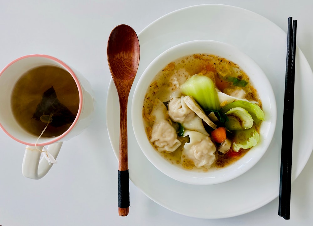 soup with vegetables in white ceramic bowl