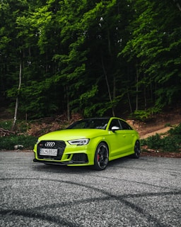 green audi coupe on road during daytime