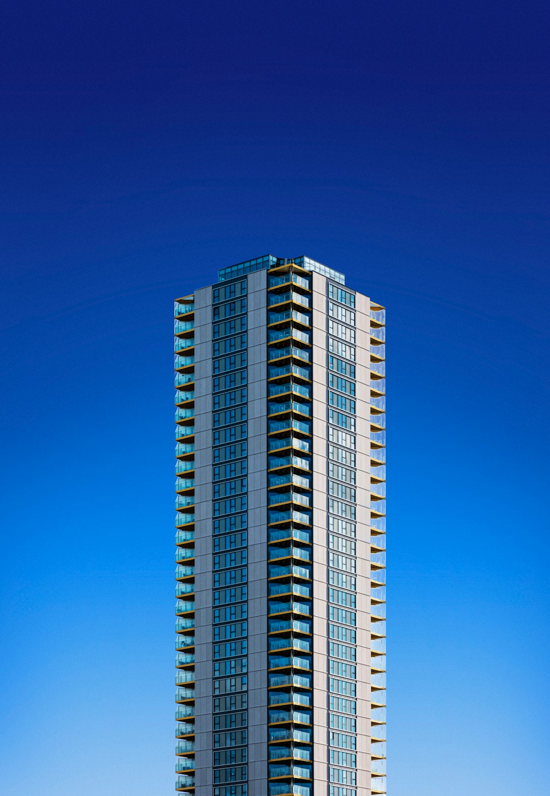 white and blue high rise building under blue sky during daytime