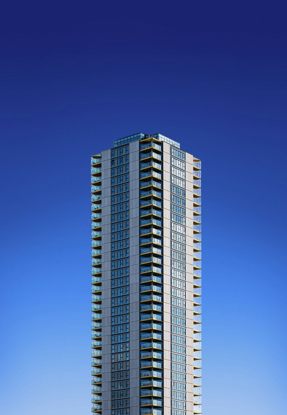 white and blue high rise building under blue sky during daytime