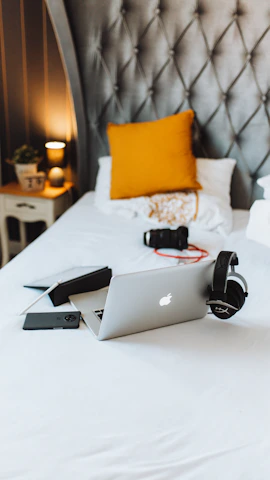 macbook air on white bed