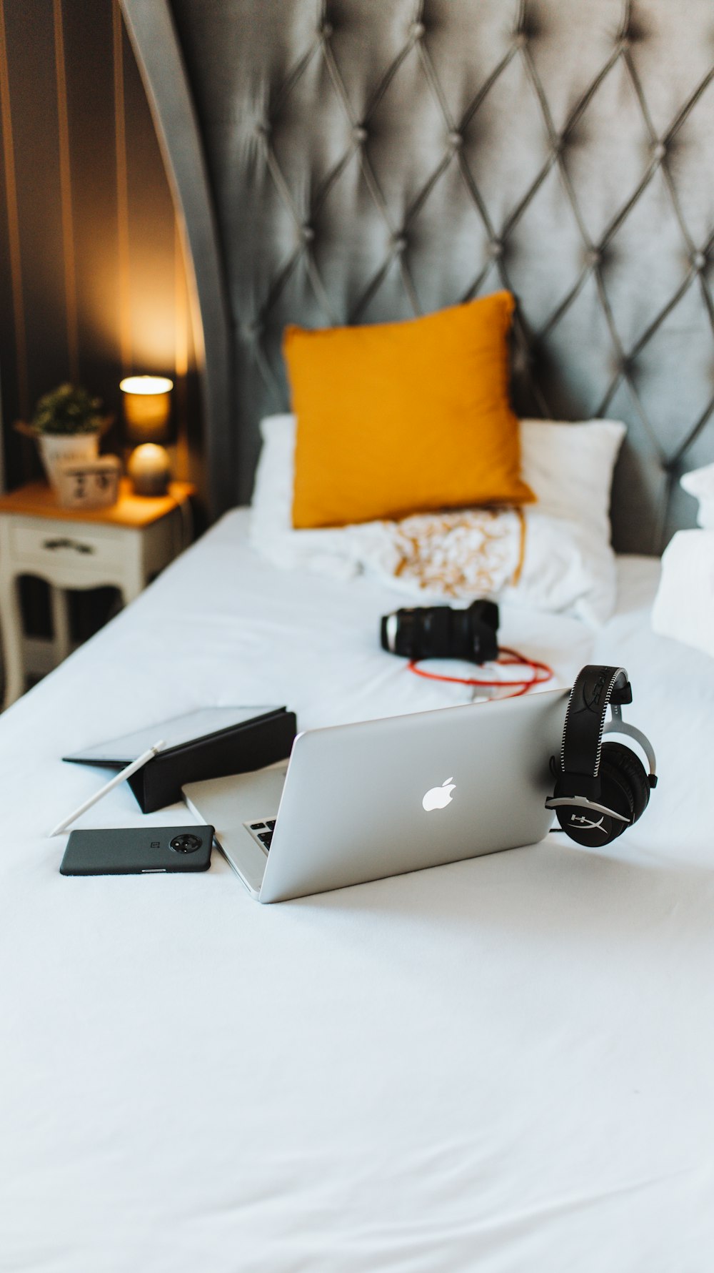 macbook air on white bed