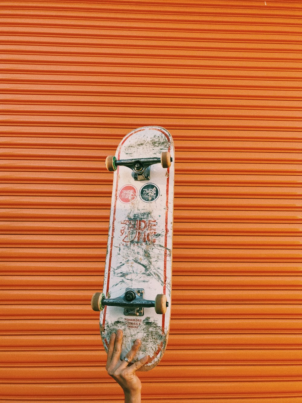 white and red wall with white and red metal door