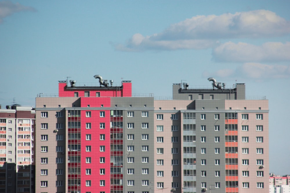 white and pink concrete building under blue sky during daytime