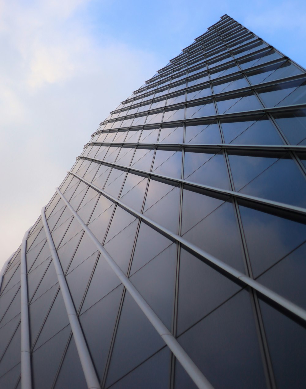 gray concrete building under white clouds during daytime