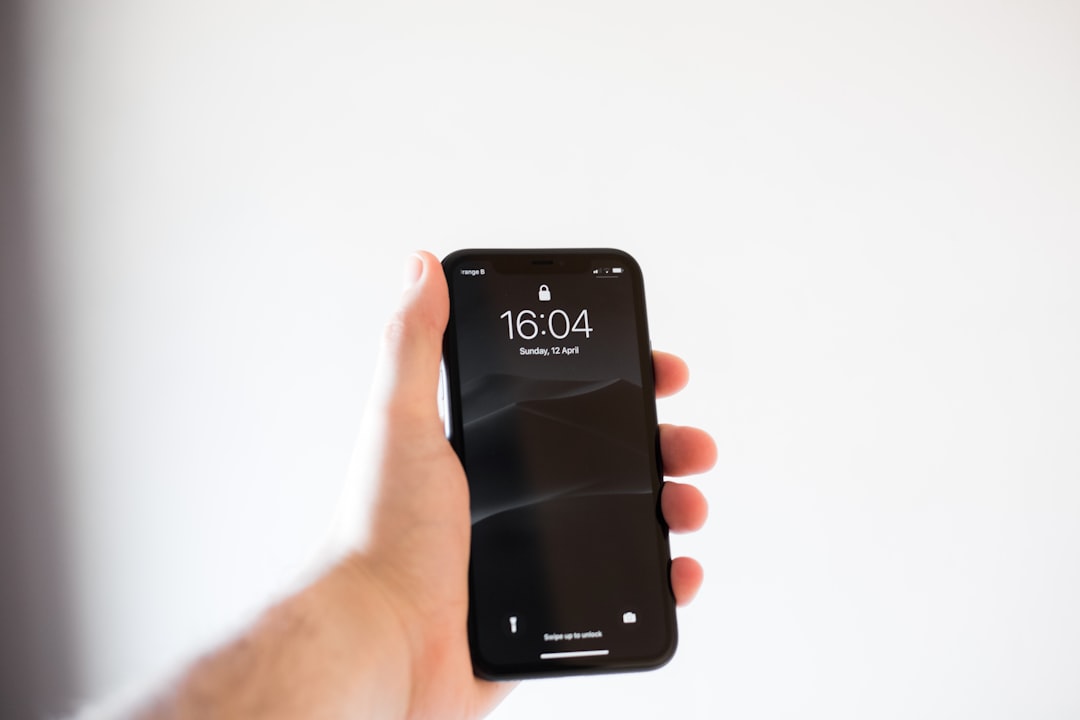 person holding black android smartphone