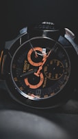 Close-up of a pilot’s wrist wearing a watch with aviation-style design elements.