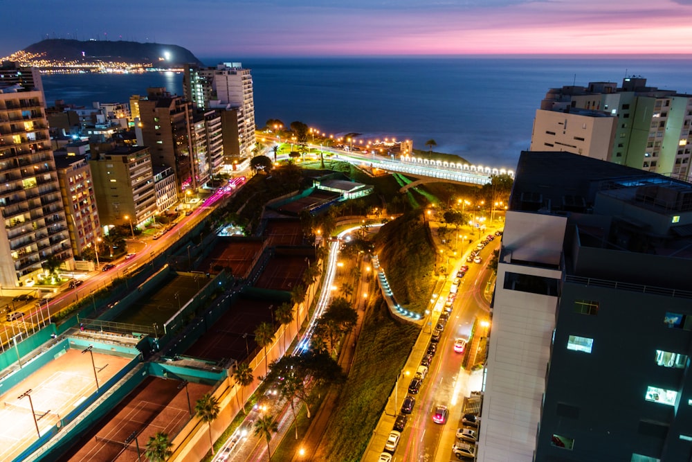 city with high rise buildings during night time