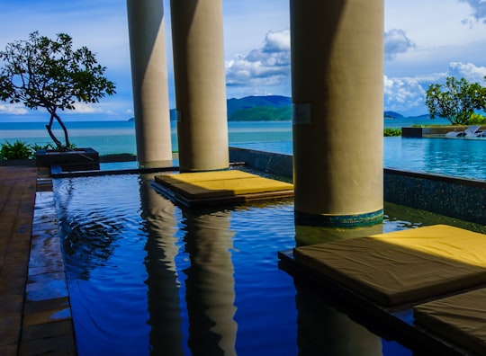 brown wooden dock on body of water during daytime in Nha Trang Vietnam