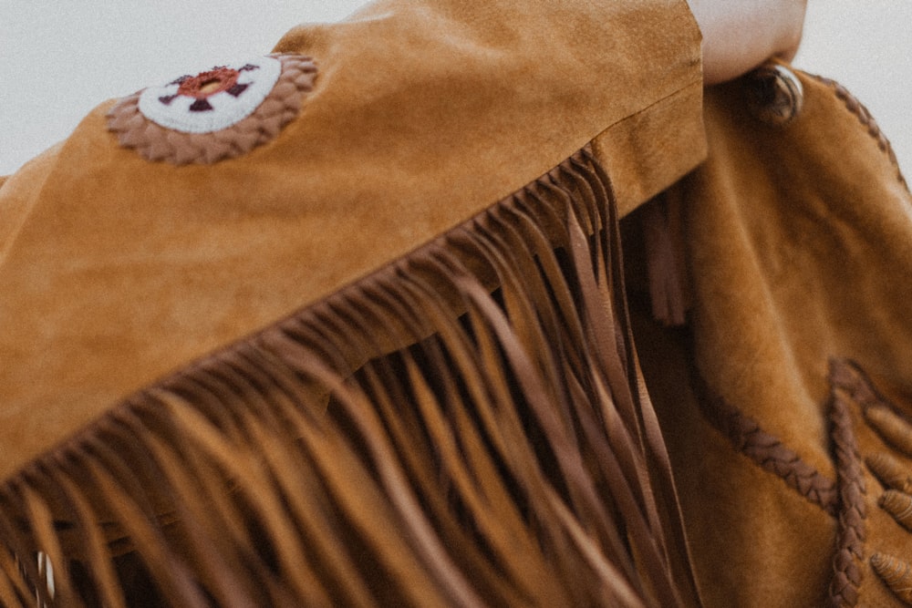 brown and white floral textile