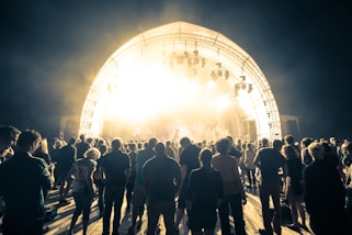 people standing on stage during night time