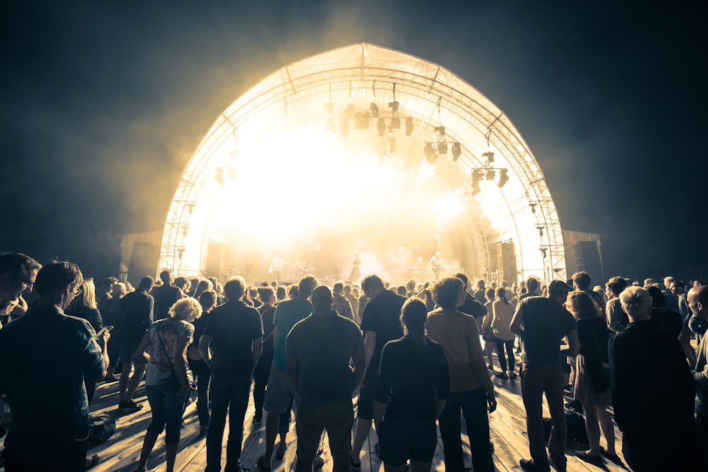 people standing on stage during night time