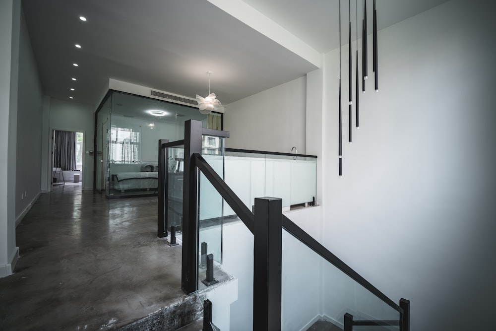 stainless steel railings near white wall