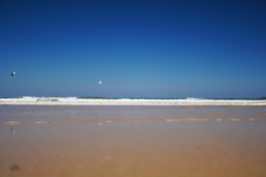 blue sky over beach during daytime in Perros-Guirec France