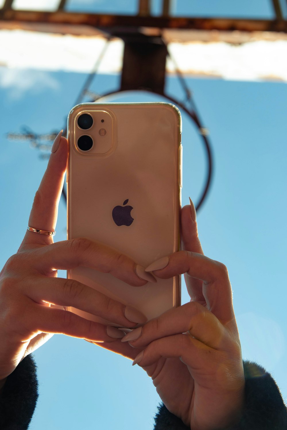 person holding gold iphone 6