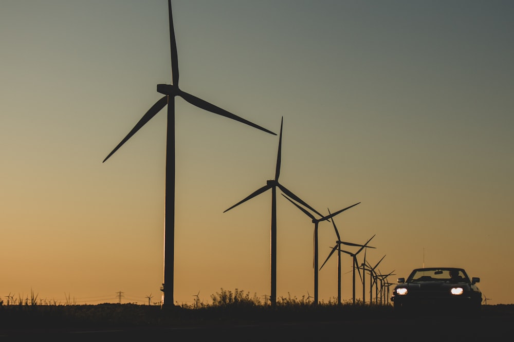 wind turbines under blue sky during daytime