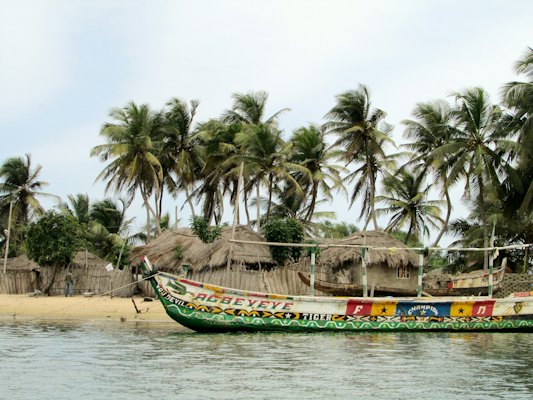 Green and red boat on sea during daytime — Accra, Ghana