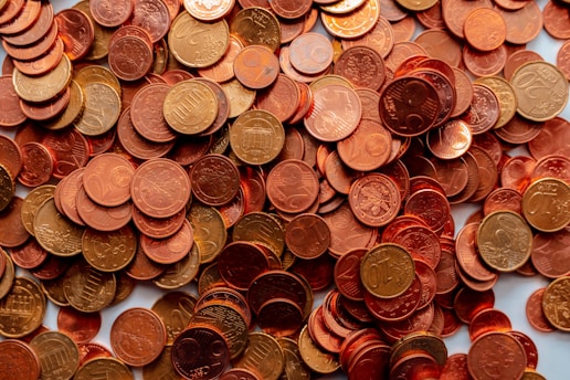 pile of round silver and gold coins