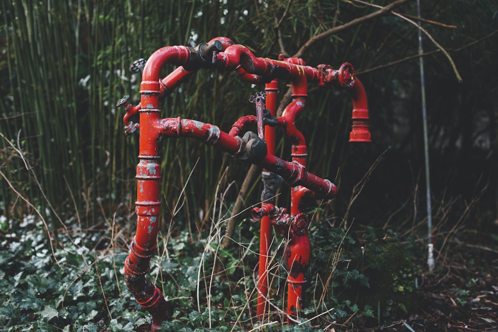red metal pipe with water dew