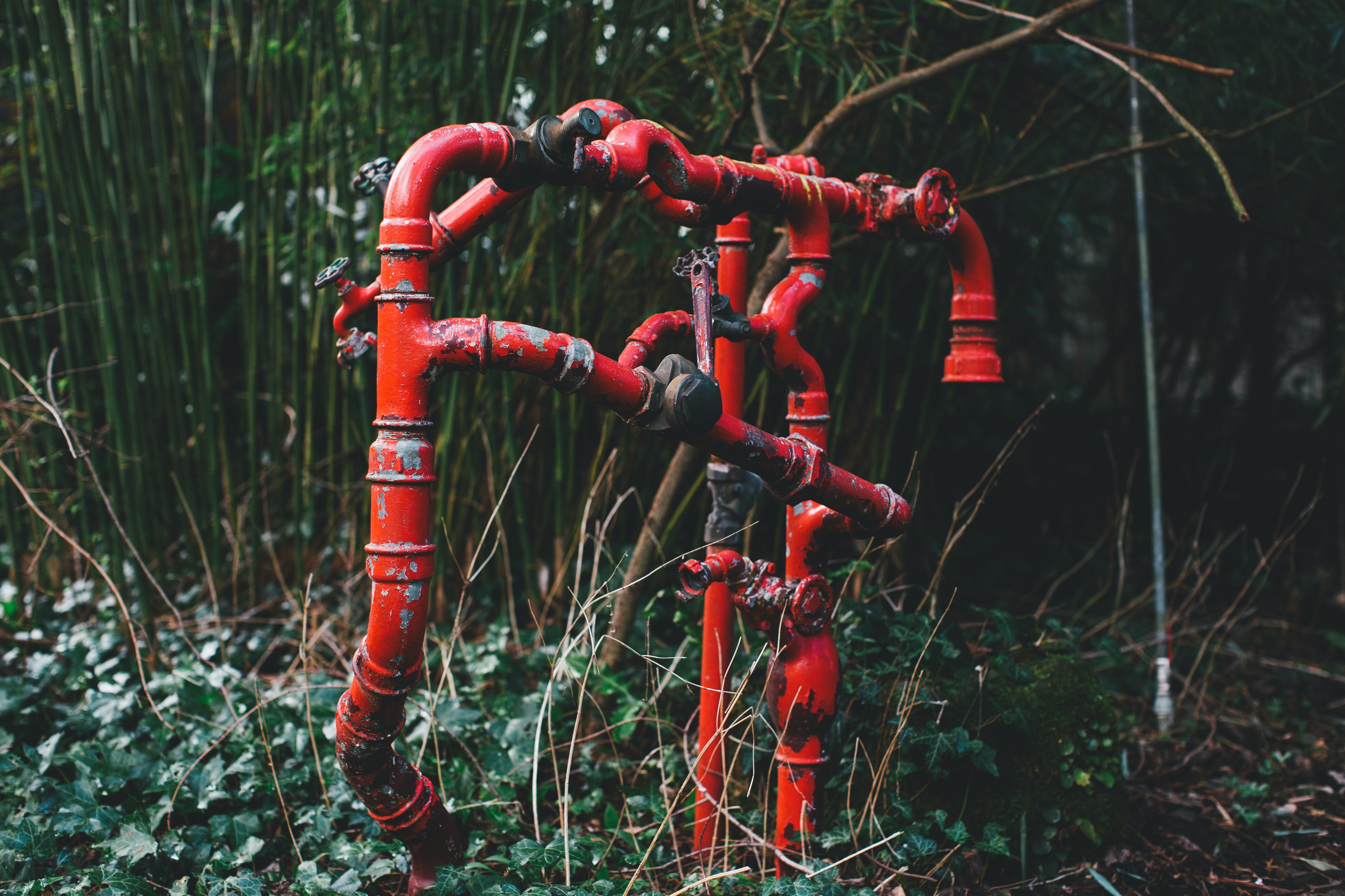 red metal pipe with water dew