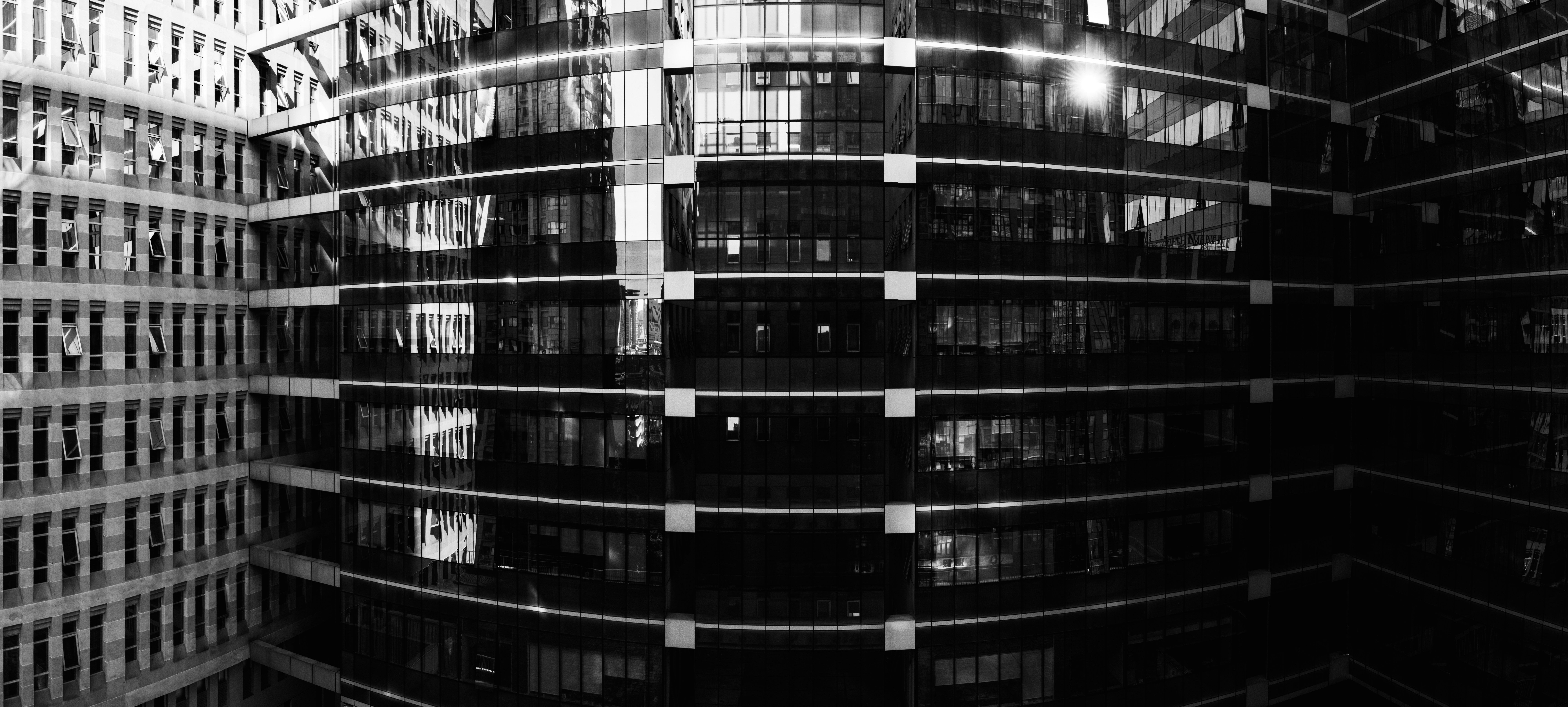 Modern office building with glass facade representing professional travel agency headquarters in Dehradun