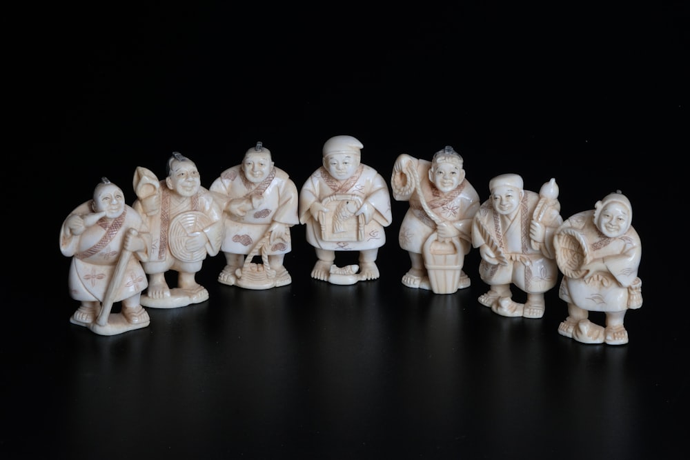 white and brown ceramic figurines