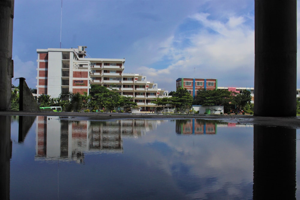 white concrete building near body of water during daytime