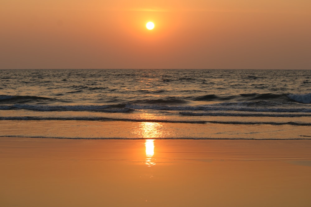 body of water during sunset