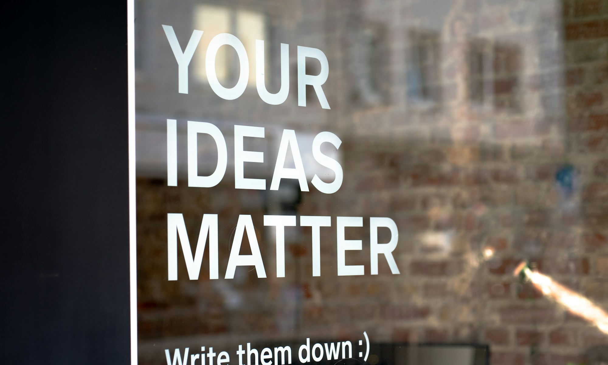 Scottish Games Network. Your Ideas Matter! Write them down :)A motivational quote on a coworking space.
