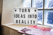white and black wooden quote board