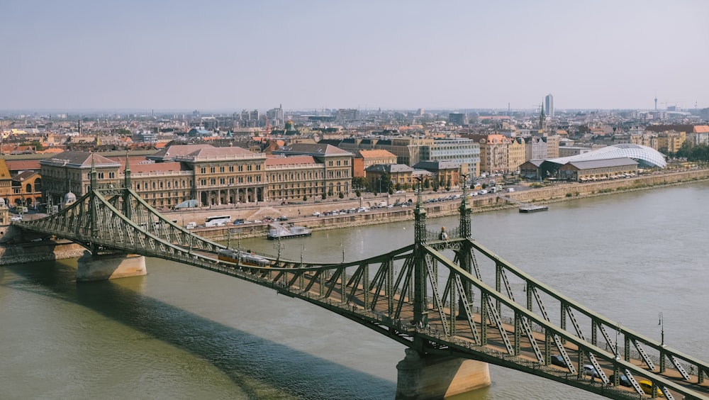 gray concrete bridge over river during daytime