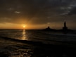 silhouette of building on island during sunset