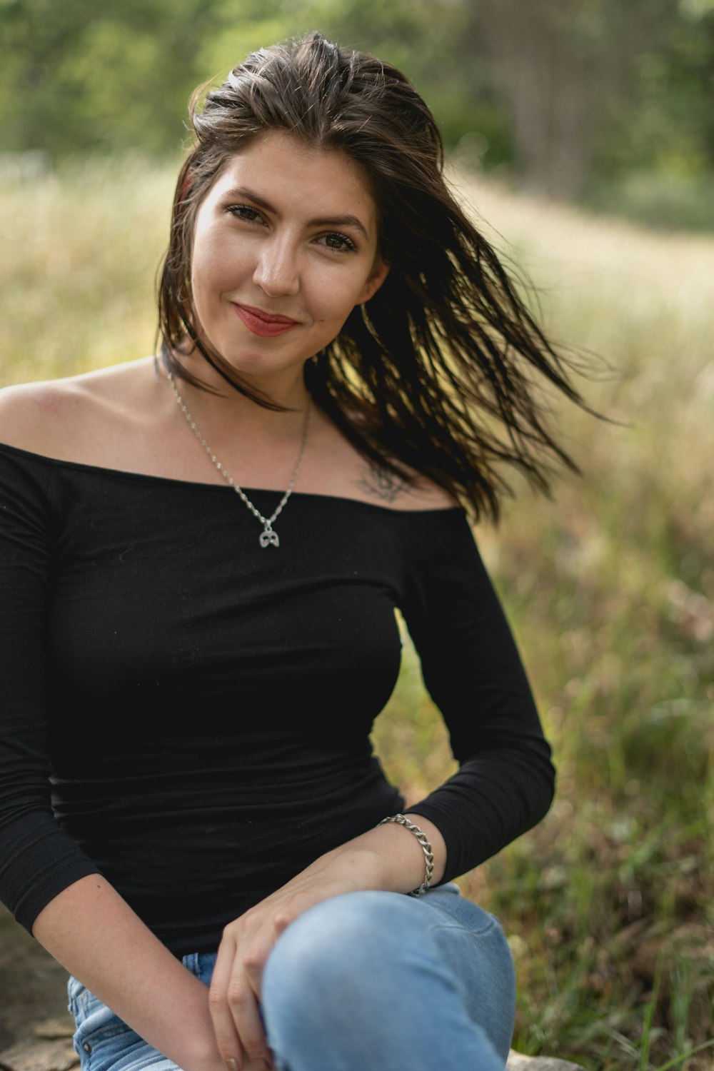 woman in black long sleeve shirt smiling