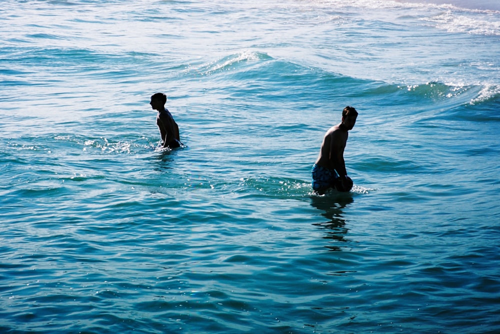 2 person in water during daytime