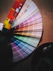 multi colored umbrella on brown wooden table