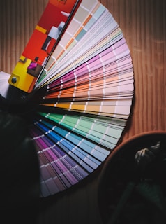 multi colored umbrella on brown wooden table