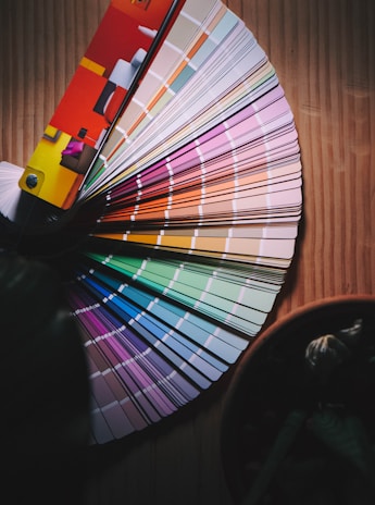 multi colored umbrella on brown wooden table