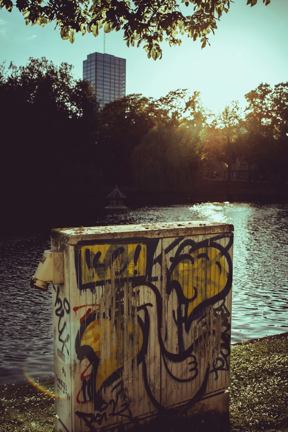 brown wooden fence near body of water during daytime