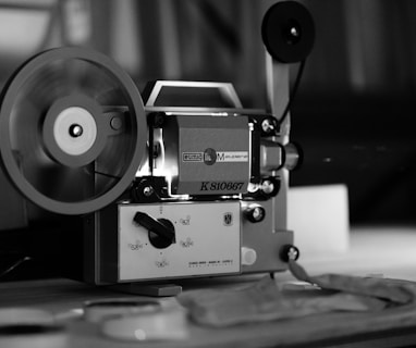 grayscale photo of camera on table