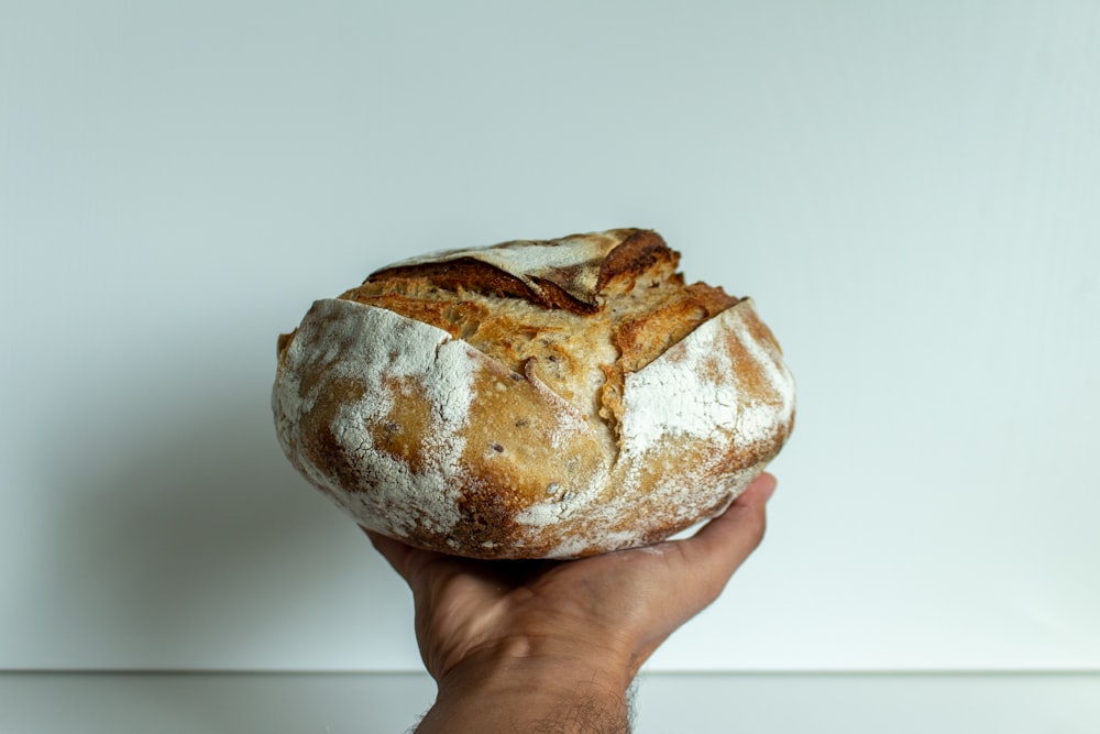 person holding bread with chocolate