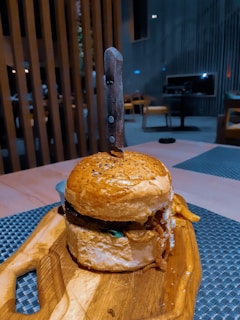 burger on brown wooden tray
