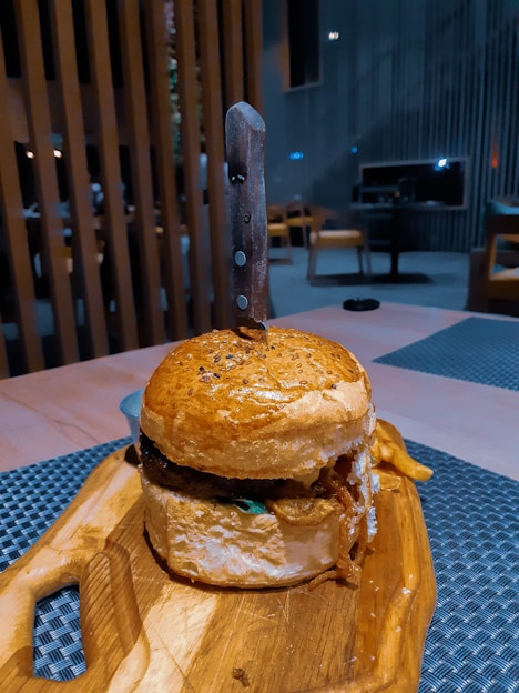 burger on brown wooden tray