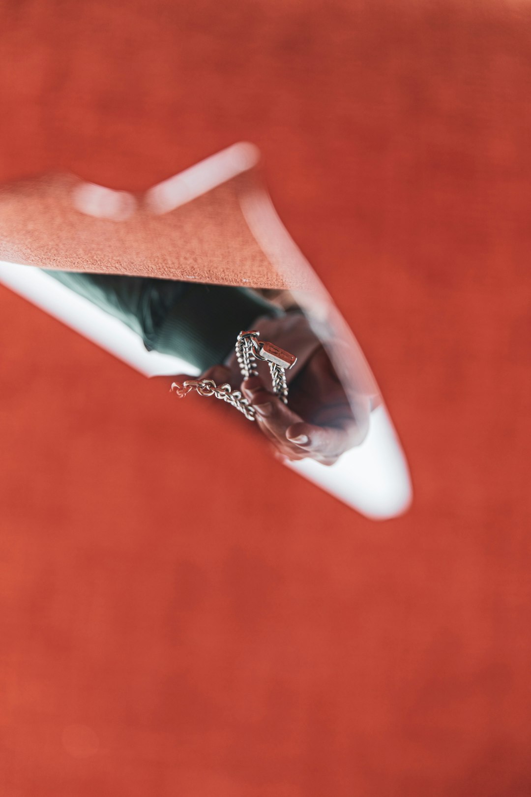 silver diamond studded ring on white ceramic plate